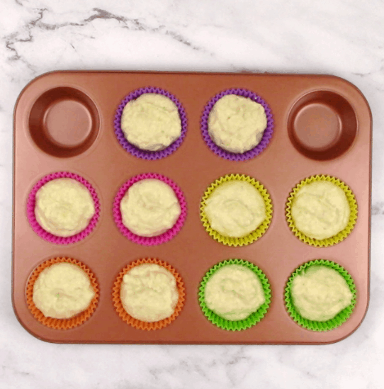 copper cupcakes pan with coconut cupcakes batter unbaked