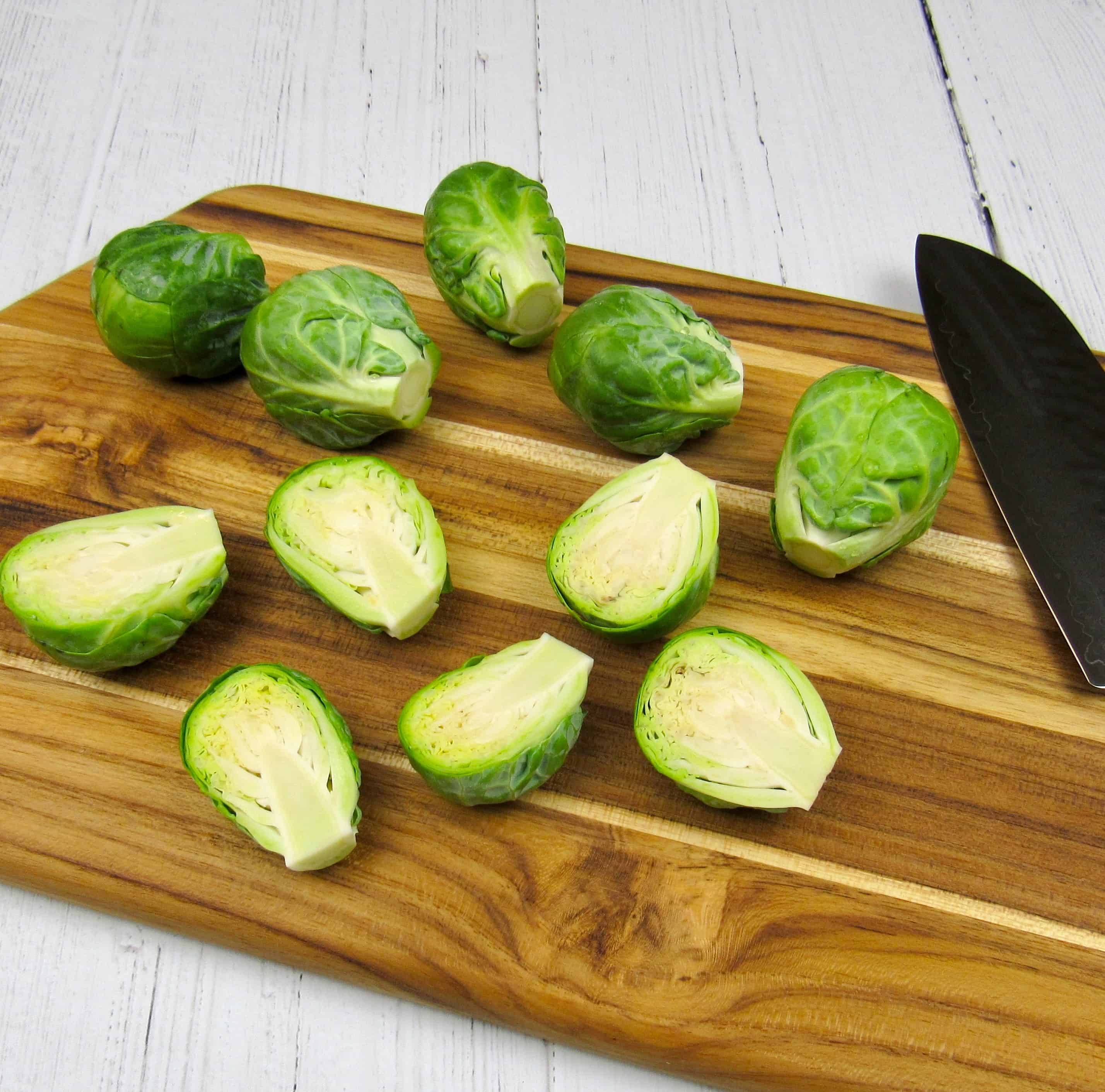 brussels sprouts cut on cutting board