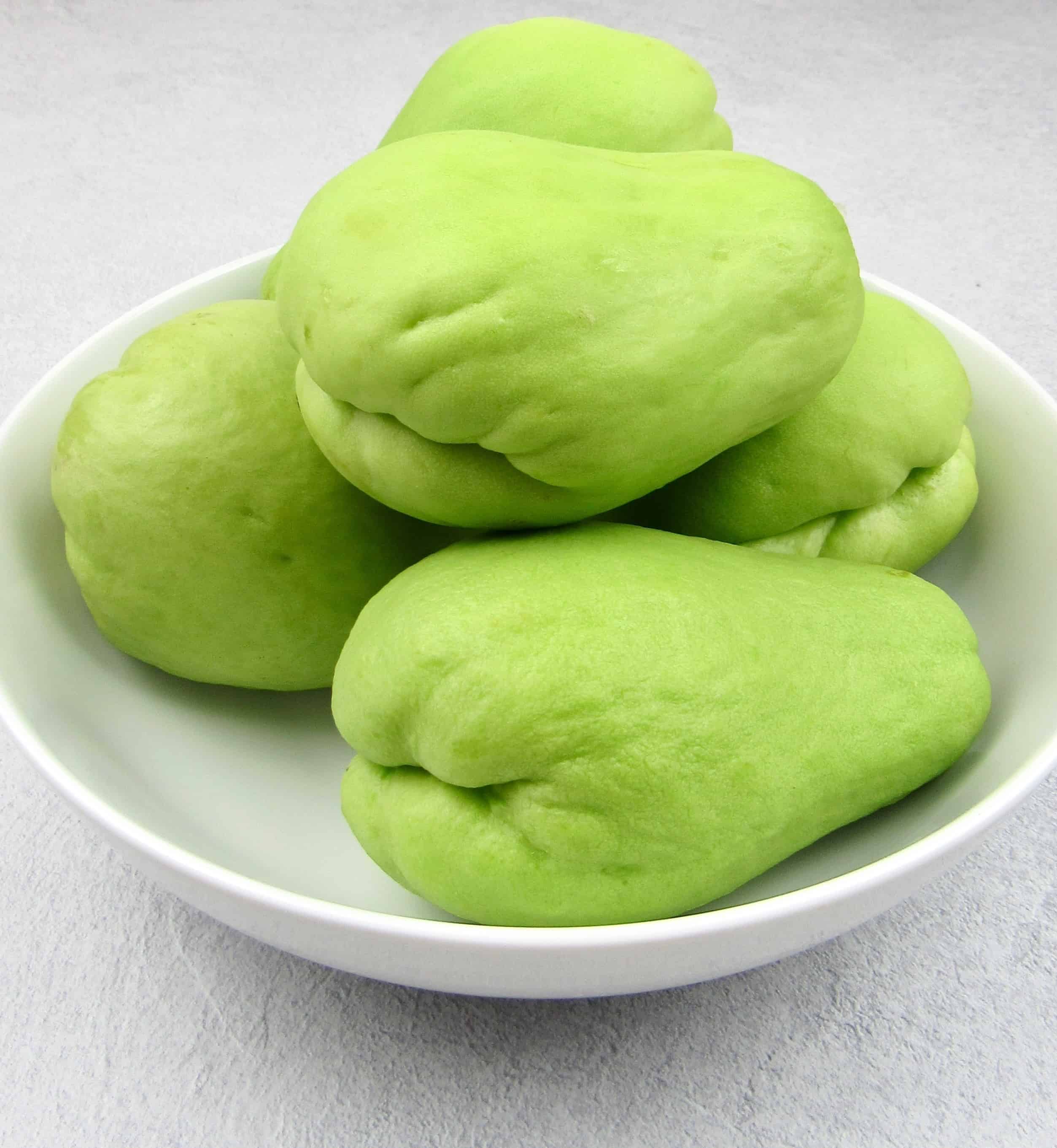 5 chayote squash in white bowl