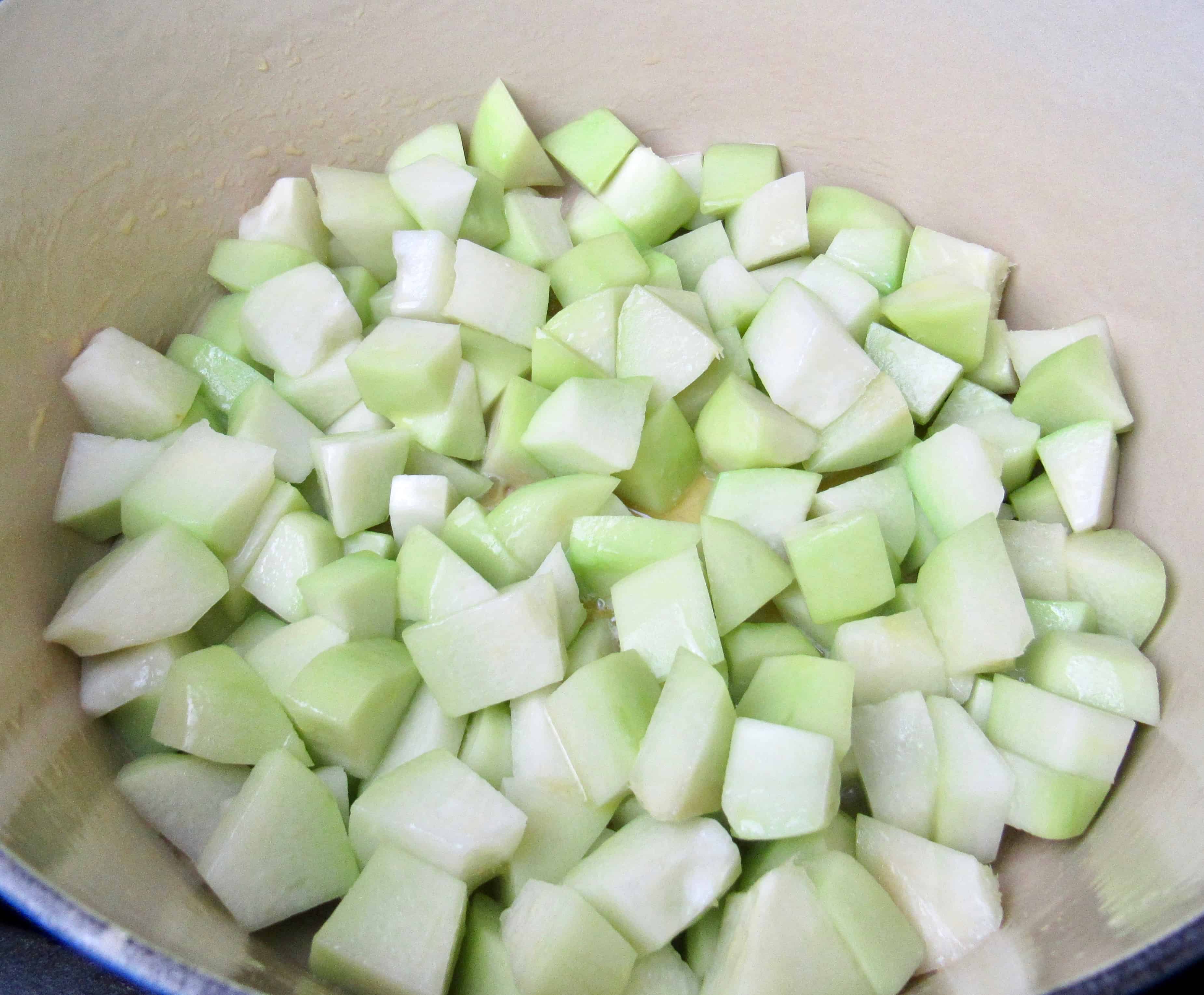 chayote squash and butter in pot