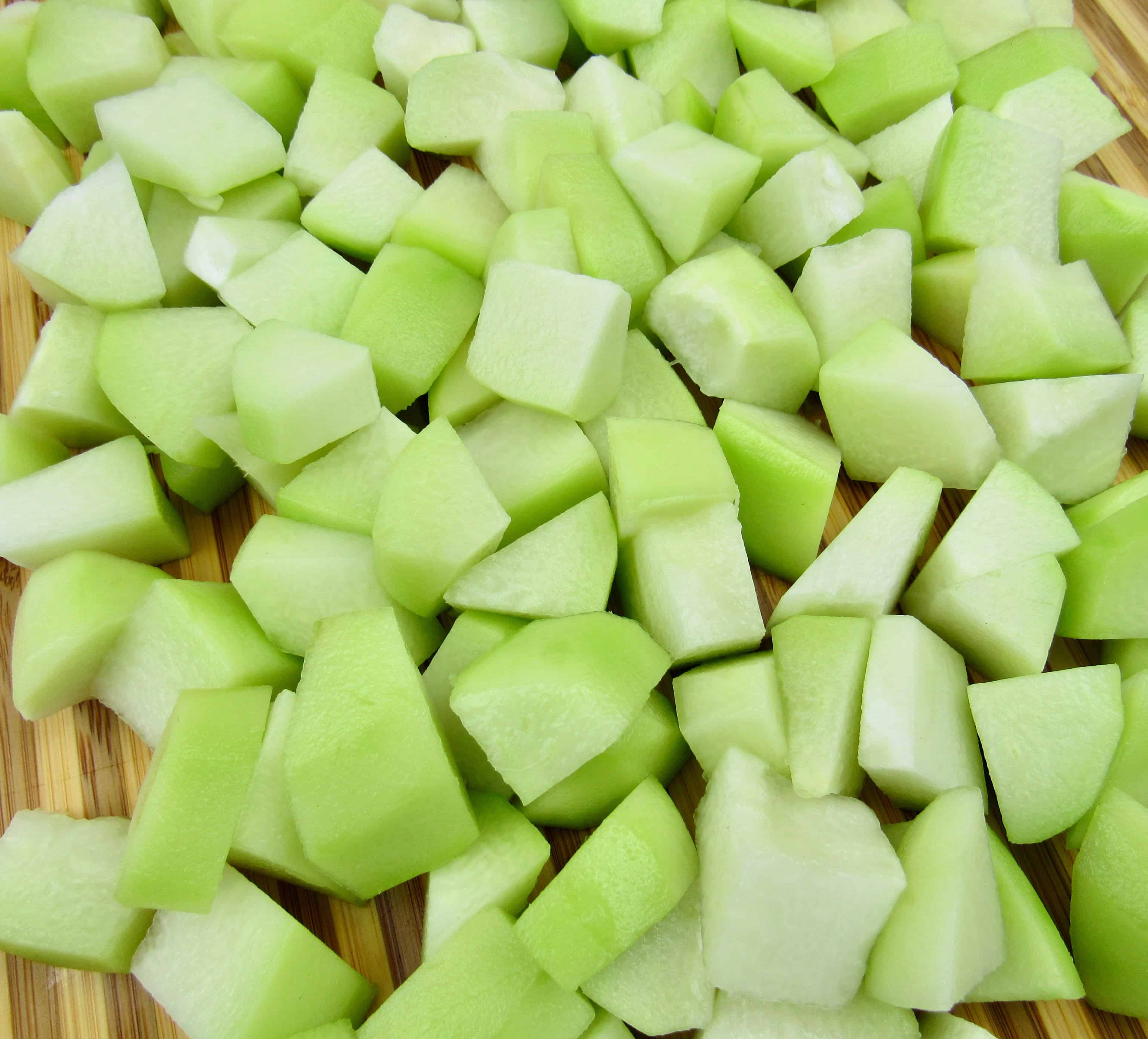 chayote squash diced on cutting board