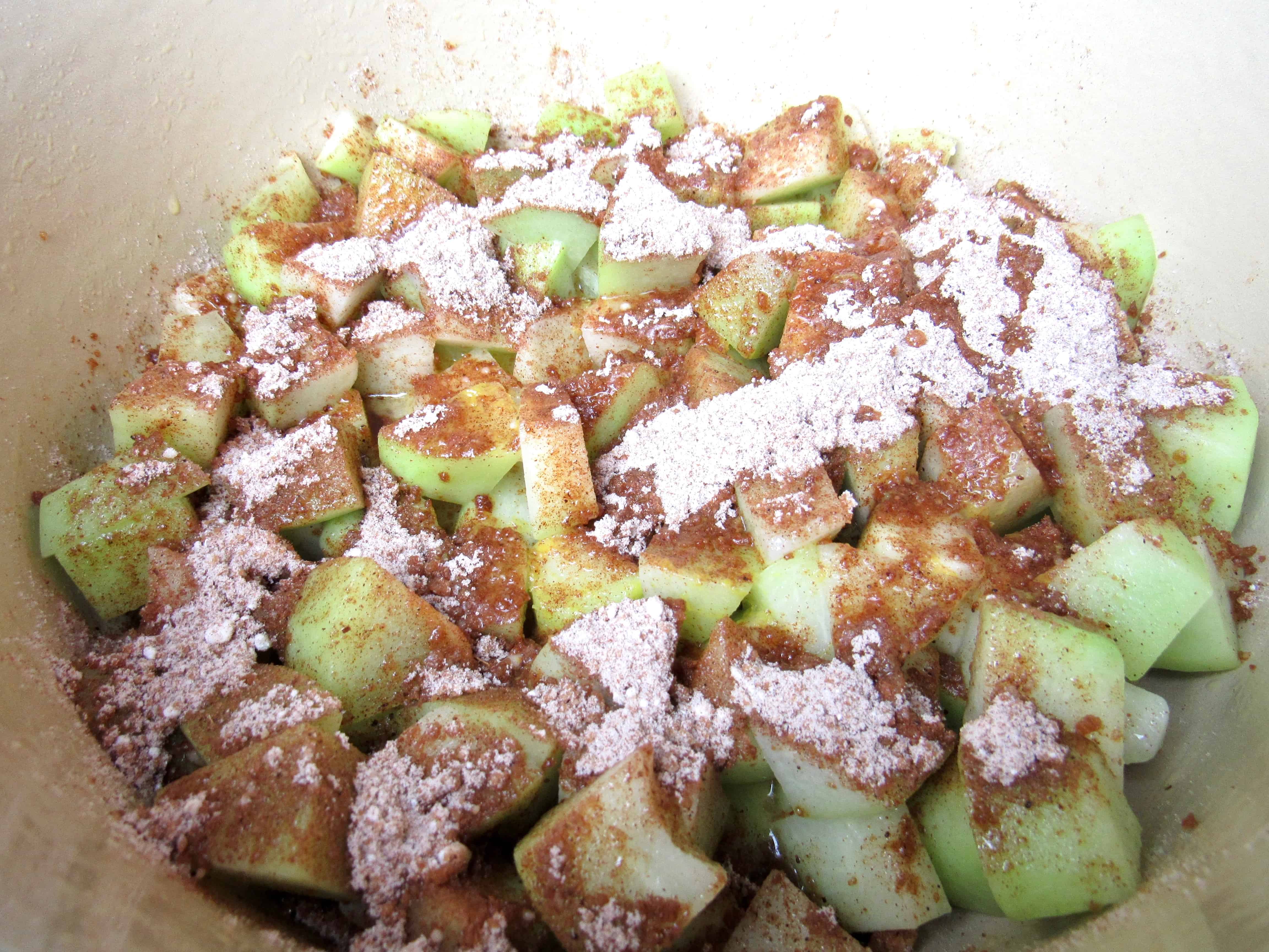 chayote squash in pot with sugar mixture on top
