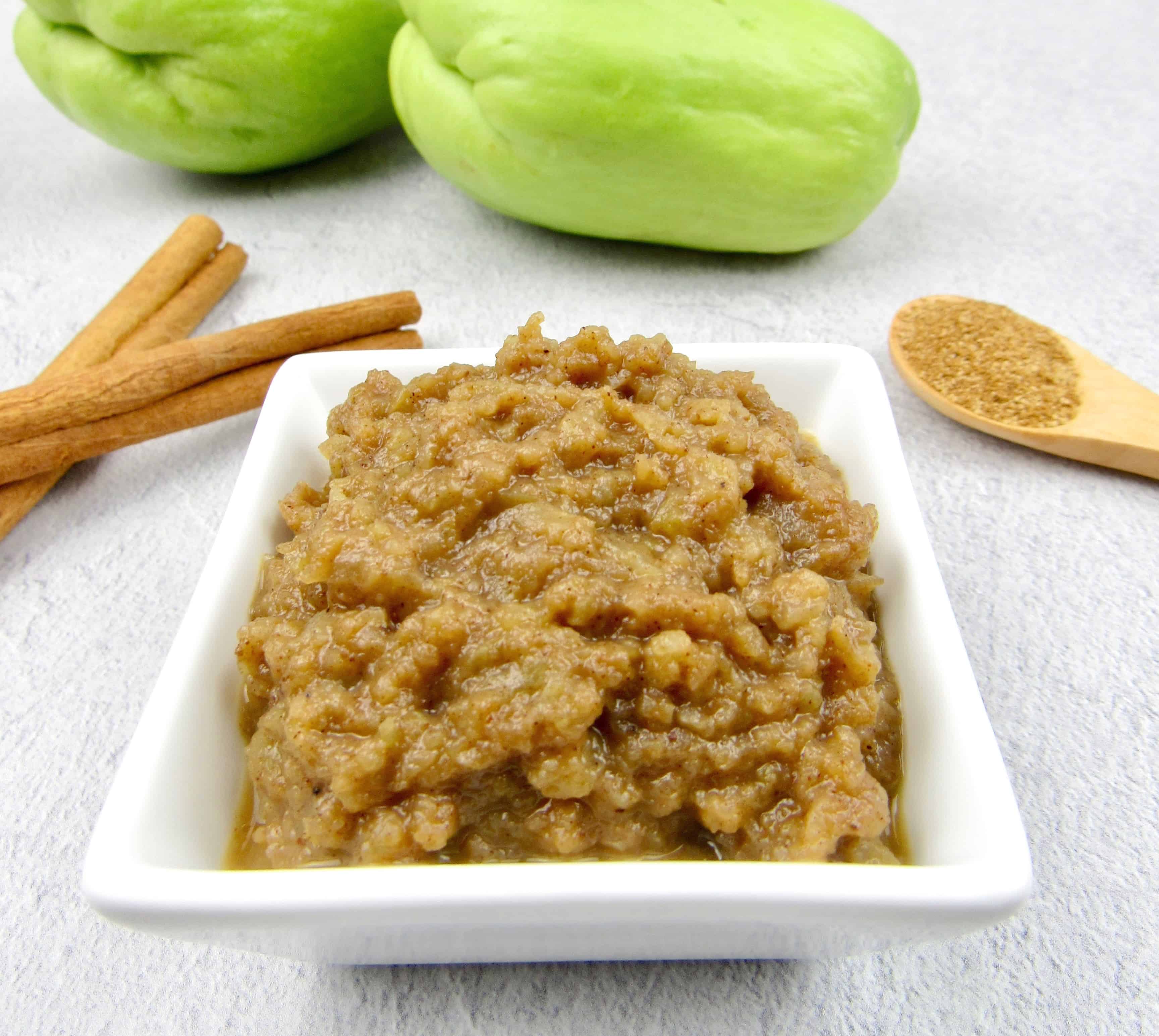 mock applesauce in white square dish with chayote squash in background