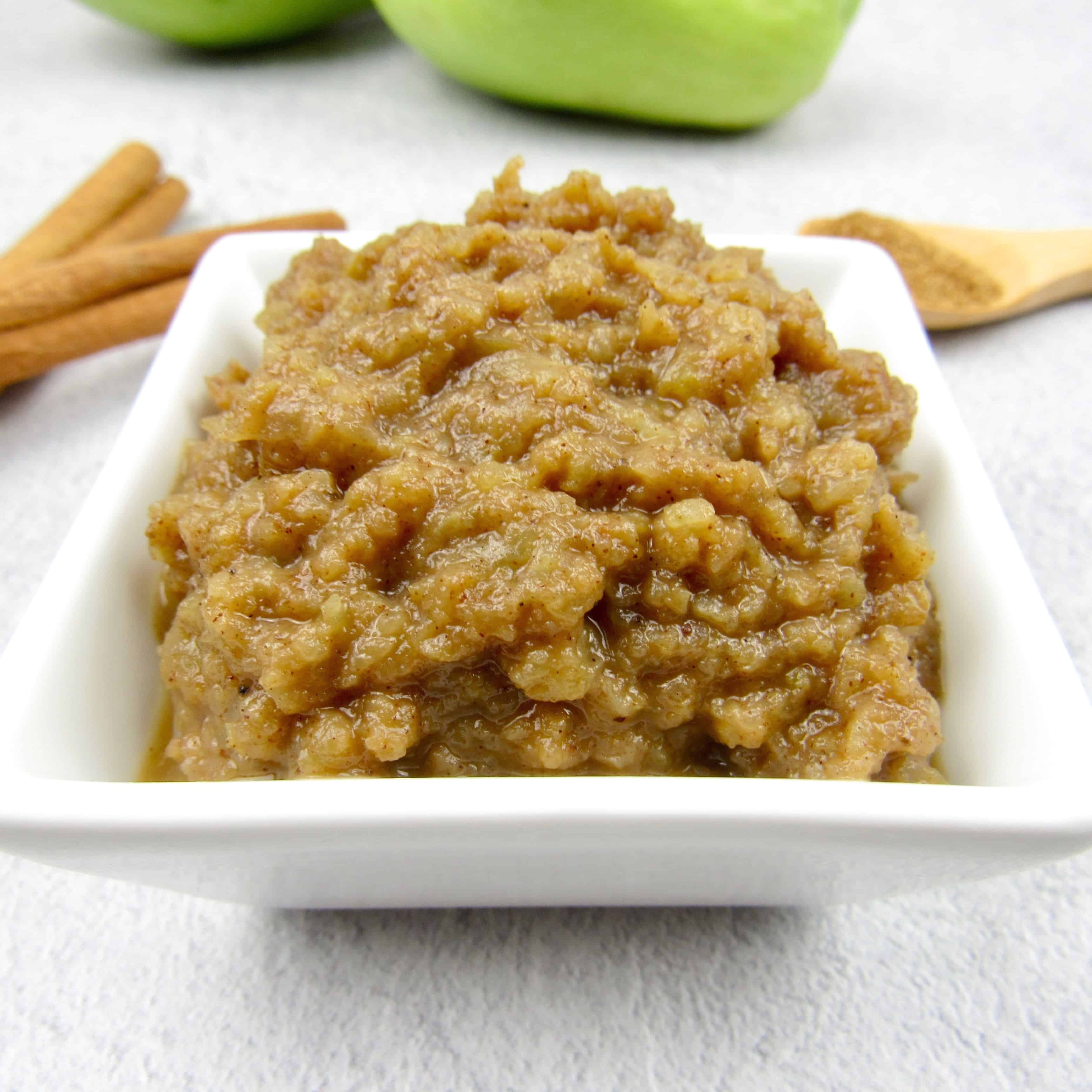 mock applesauce in white square dish with chayote squash in background