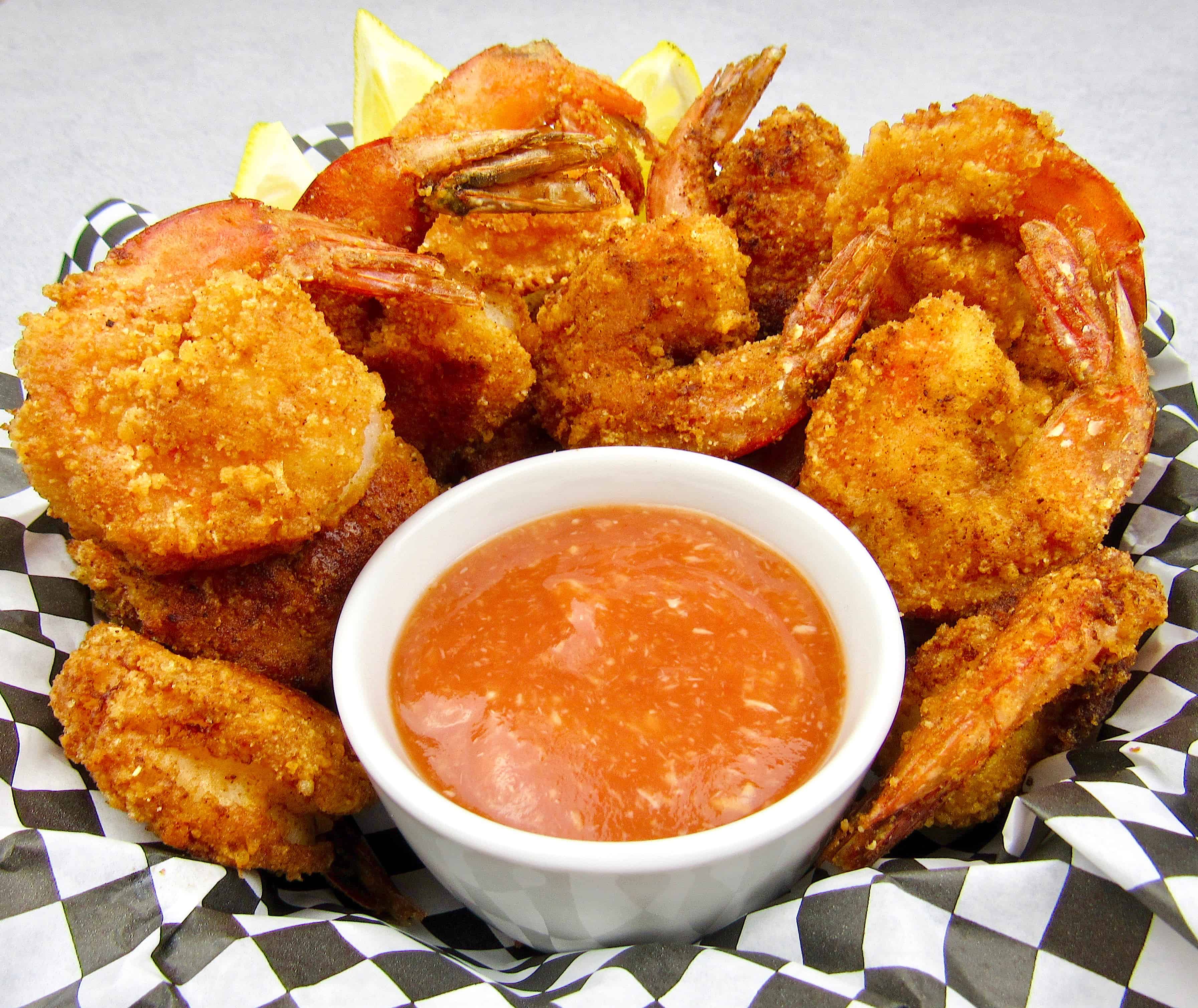 basket of fried shrimp with cocktail sauce