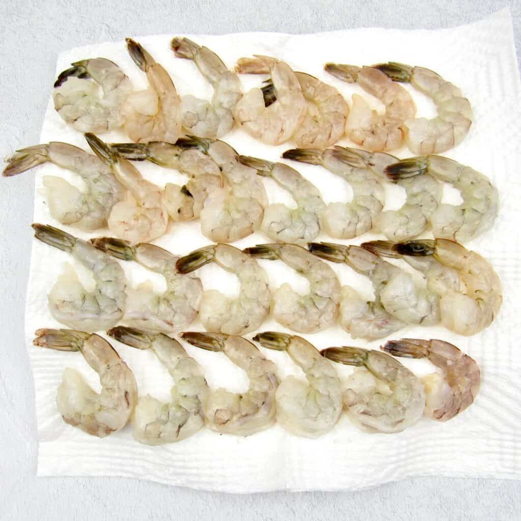 raw shrimp on plate with paper towels
