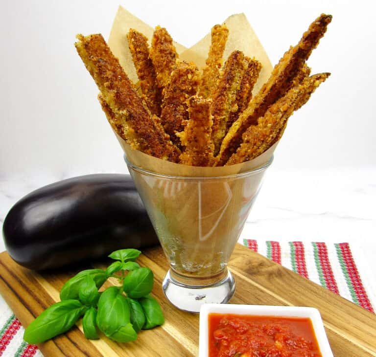 eggplant fries in glass with marinara and basil on side