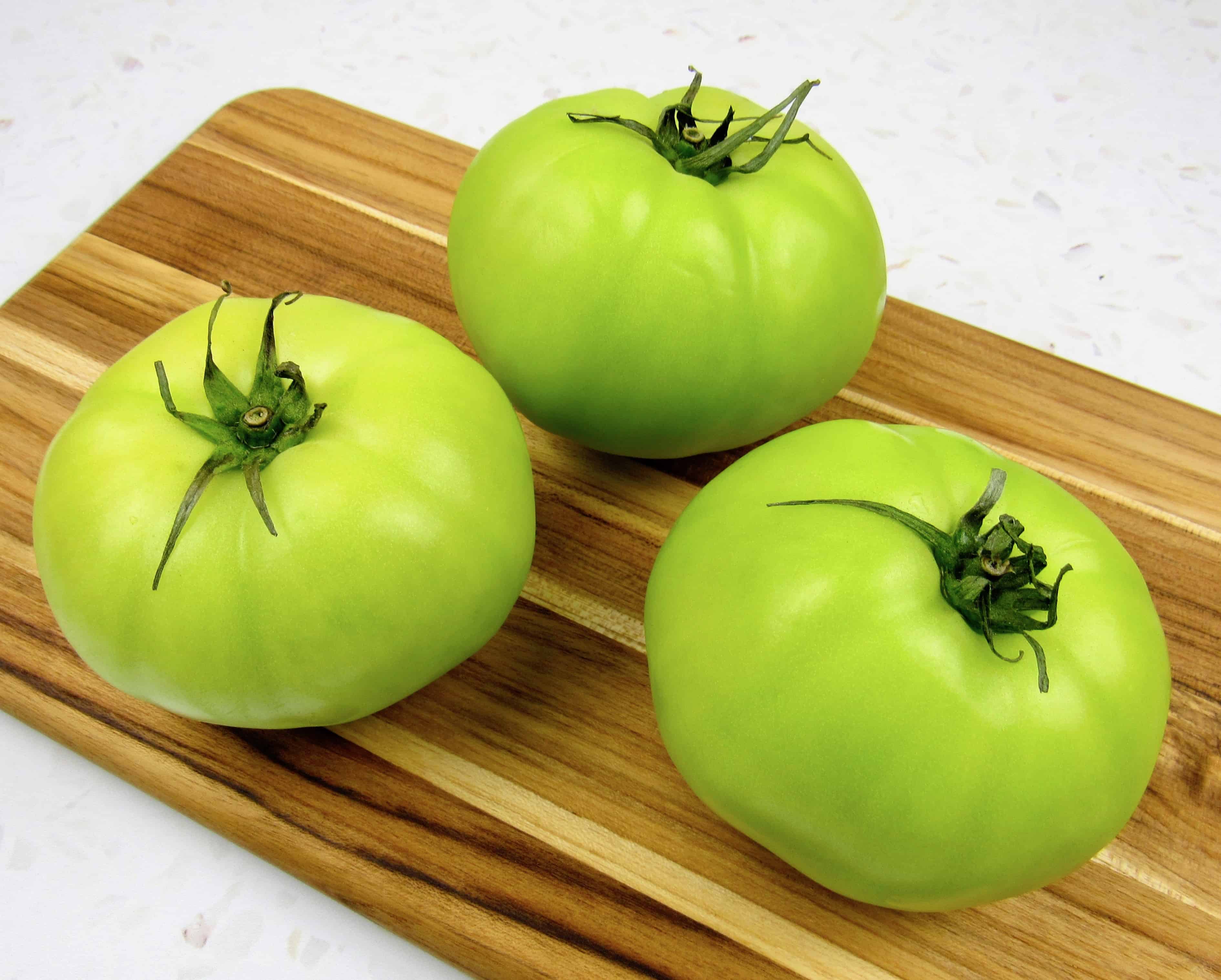 green tomatoes on cutting board