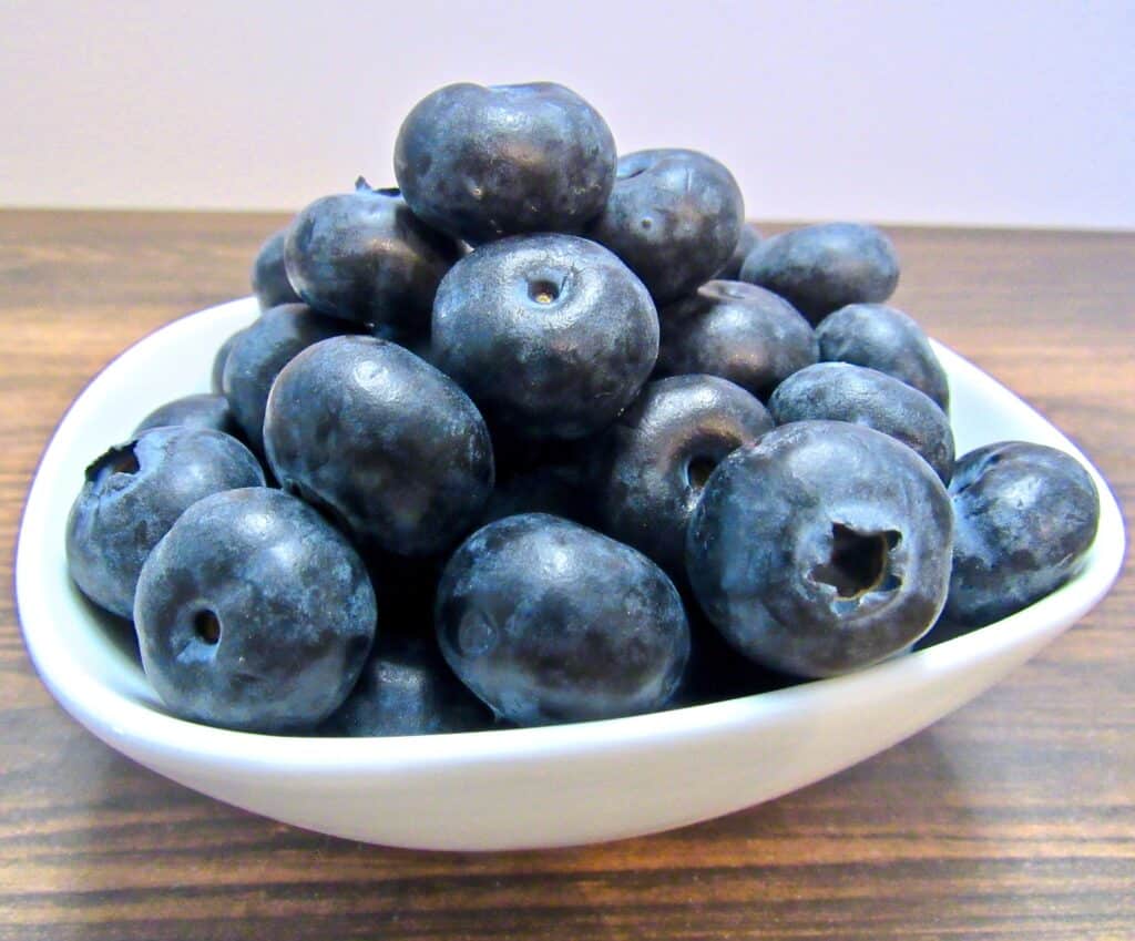 white bowl with blueberries