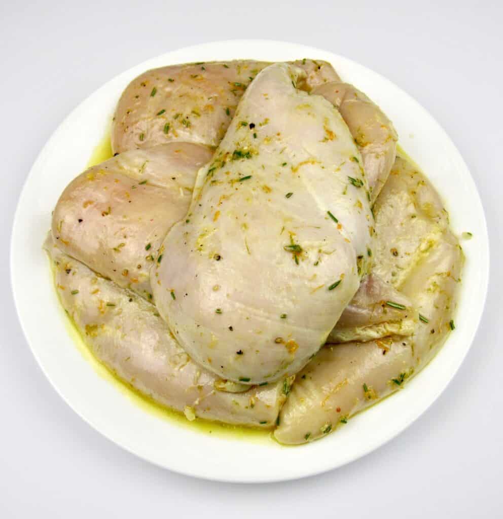 marinated chicken breasts on white plate