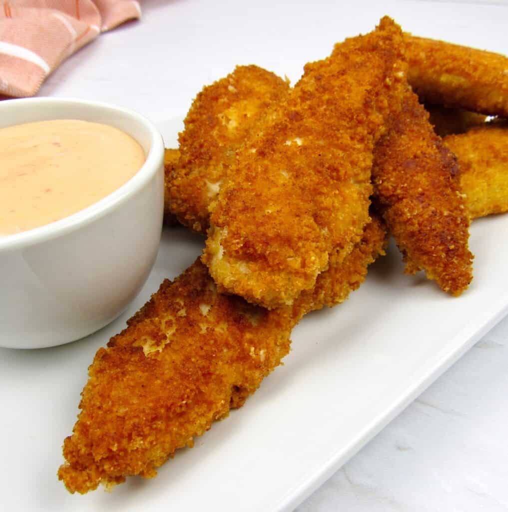 chicken tenders on white plate