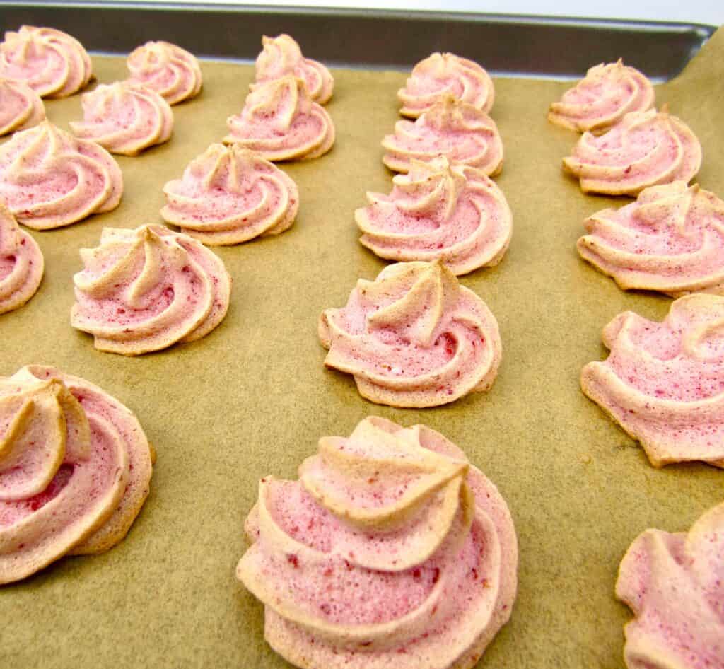 Keto Strawberry Meringue Cookies on baking sheet baked