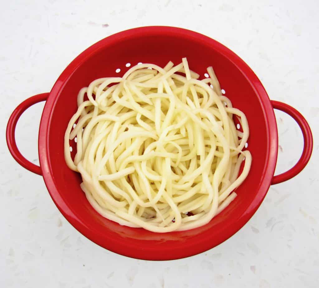 red collander with Palmini noodles