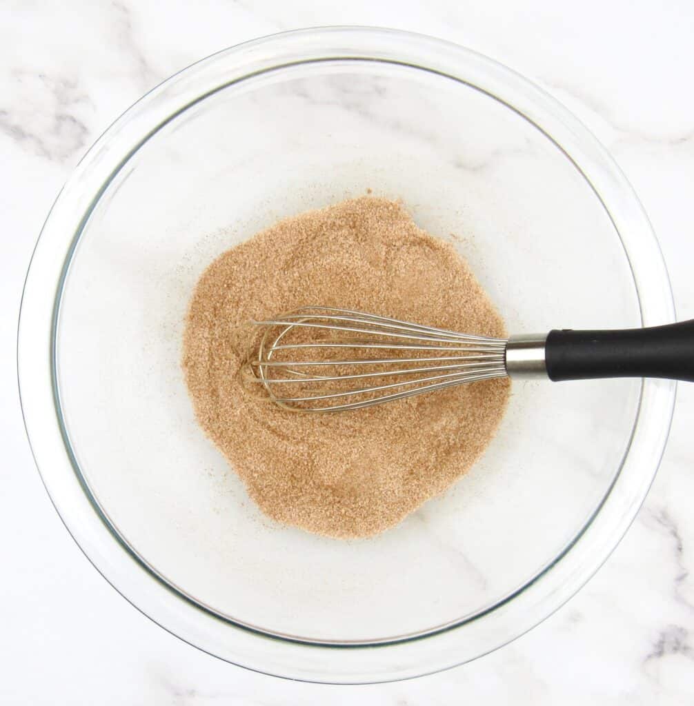 cinnamon sugar in bowl with whisk