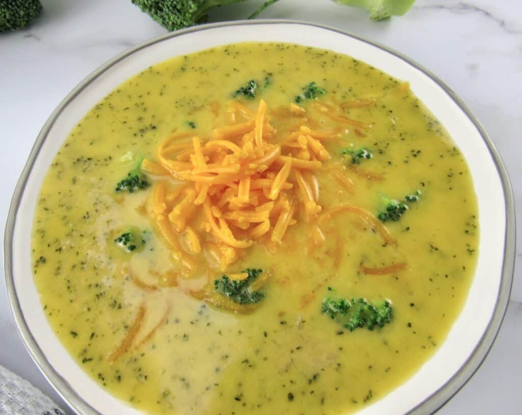overhead view of broccoli cheese soup in bowl