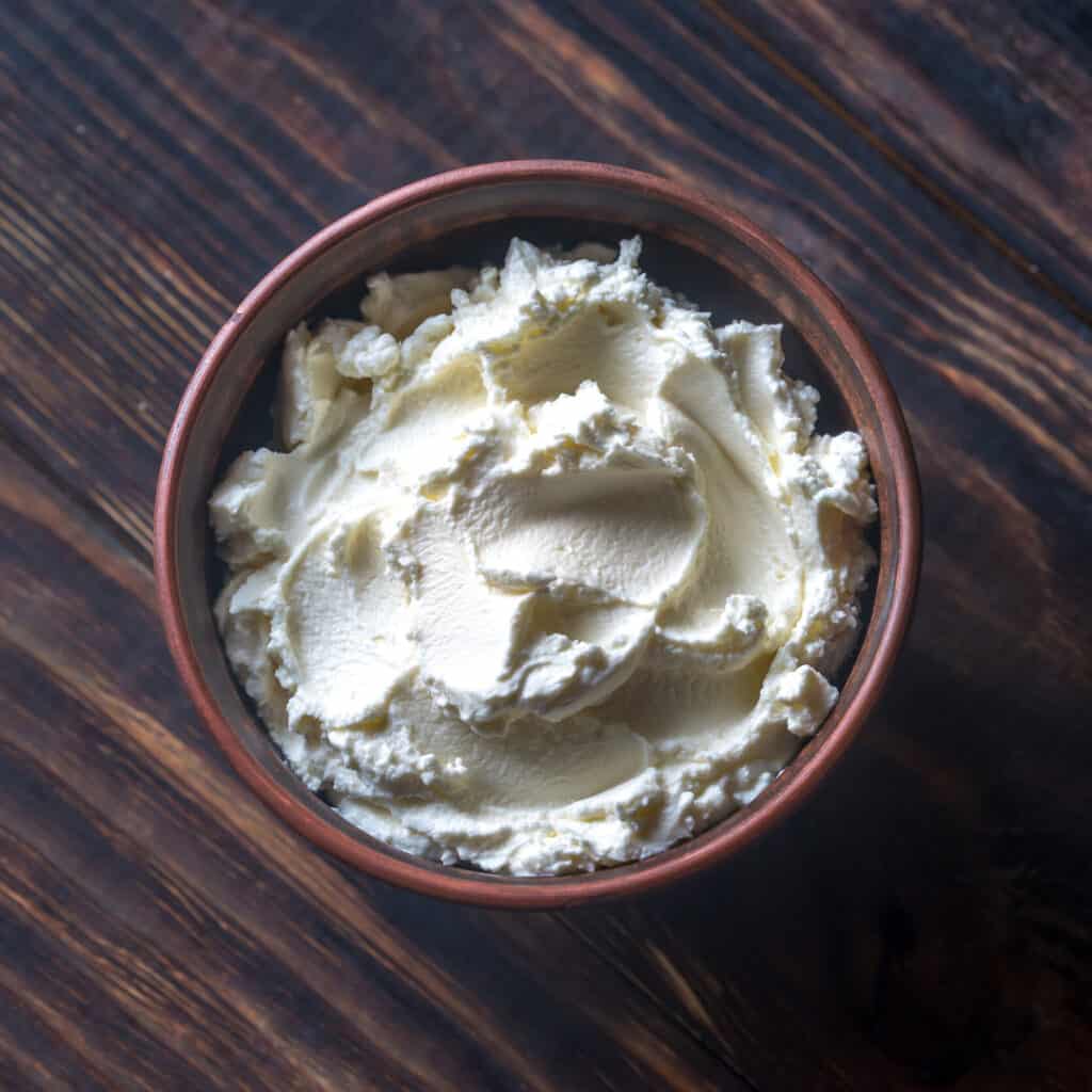 Cream Cheese in dark wooden bowl