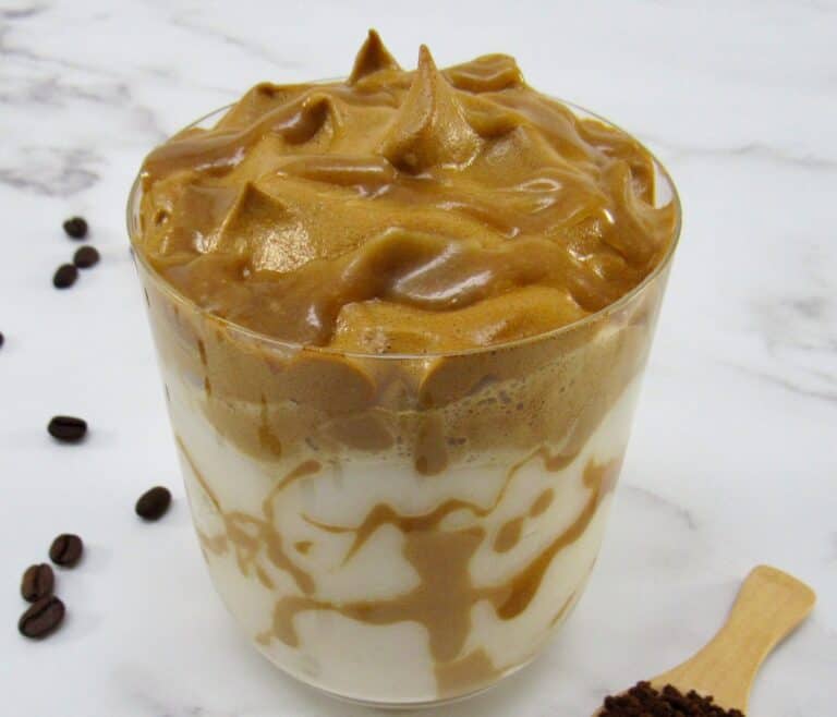 glass of dalgona coffee with caramel on top