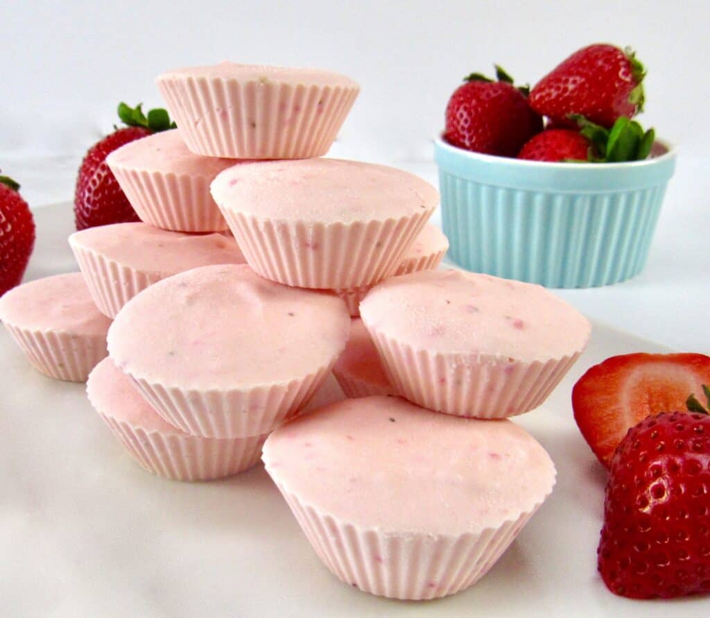 Strawberry Cheesecake Fat Bombs with strawberries in blue bowl