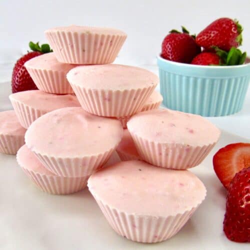 Strawberry Cheesecake Fat Bombs with strawberries in blue bowl