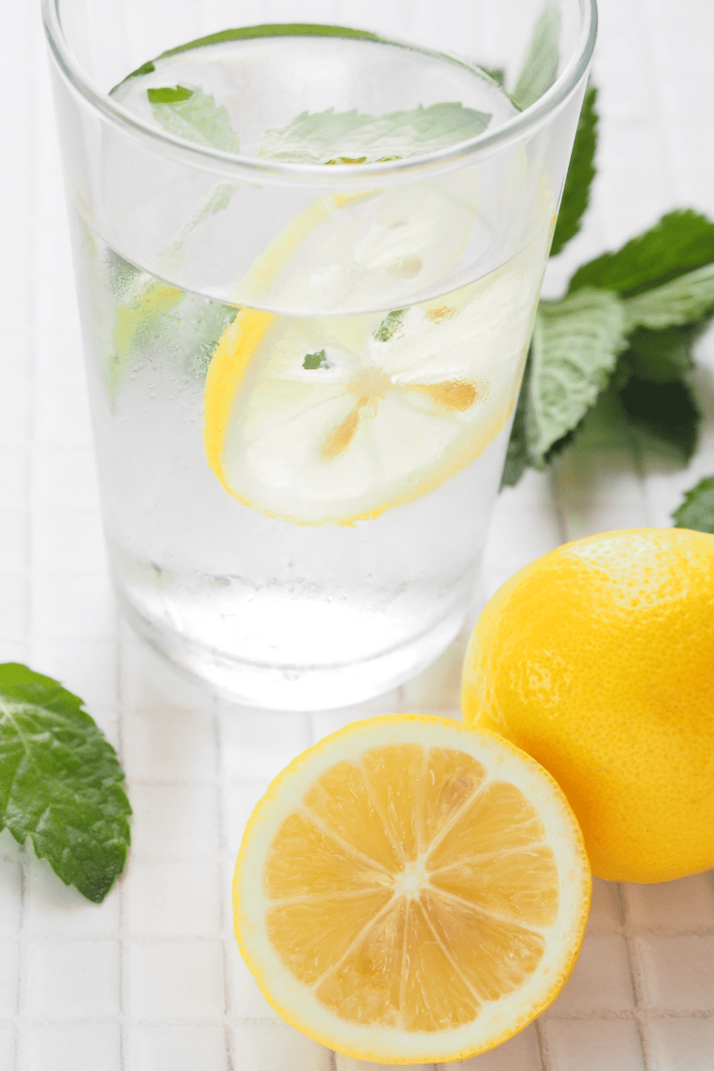 lemon water with lemon slice on side