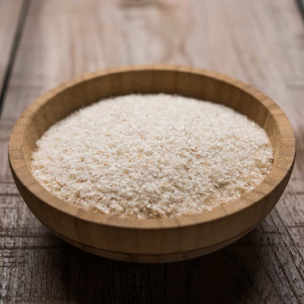 Psyllium Husk Powder in wooden bowl