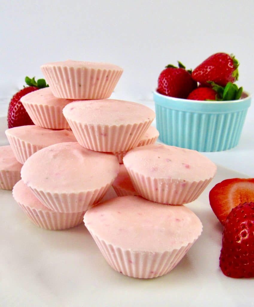 Strawberry Cheesecake Fat Bombs with strawberries in blue bowl