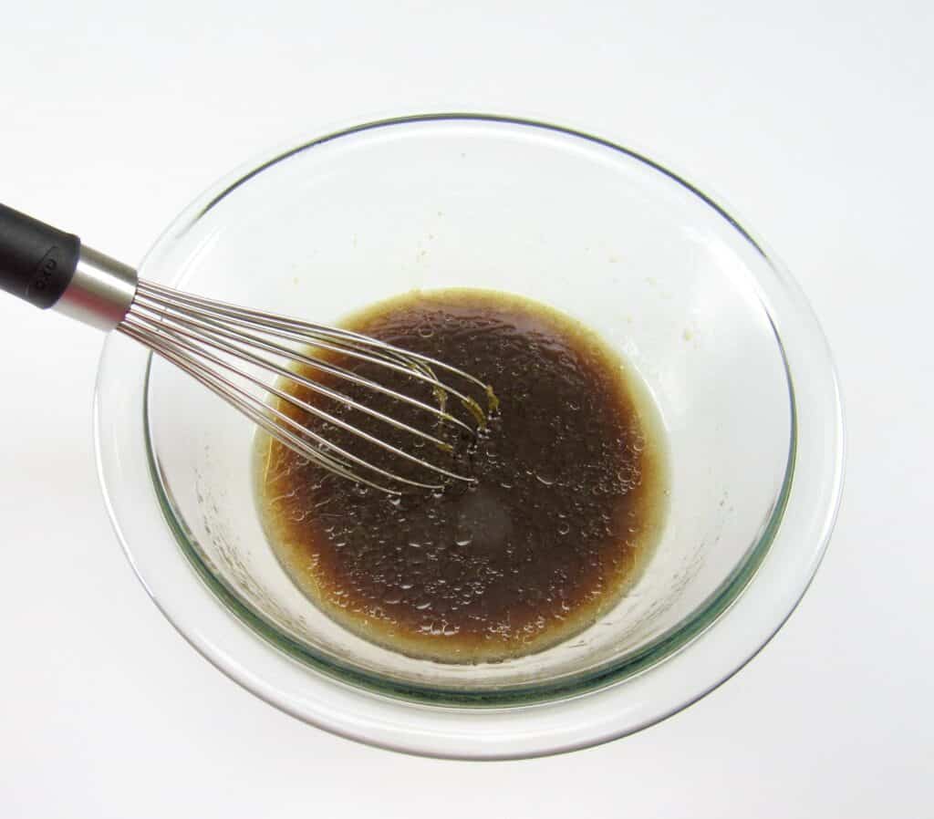 asian marinade in mixing bowl with whisk