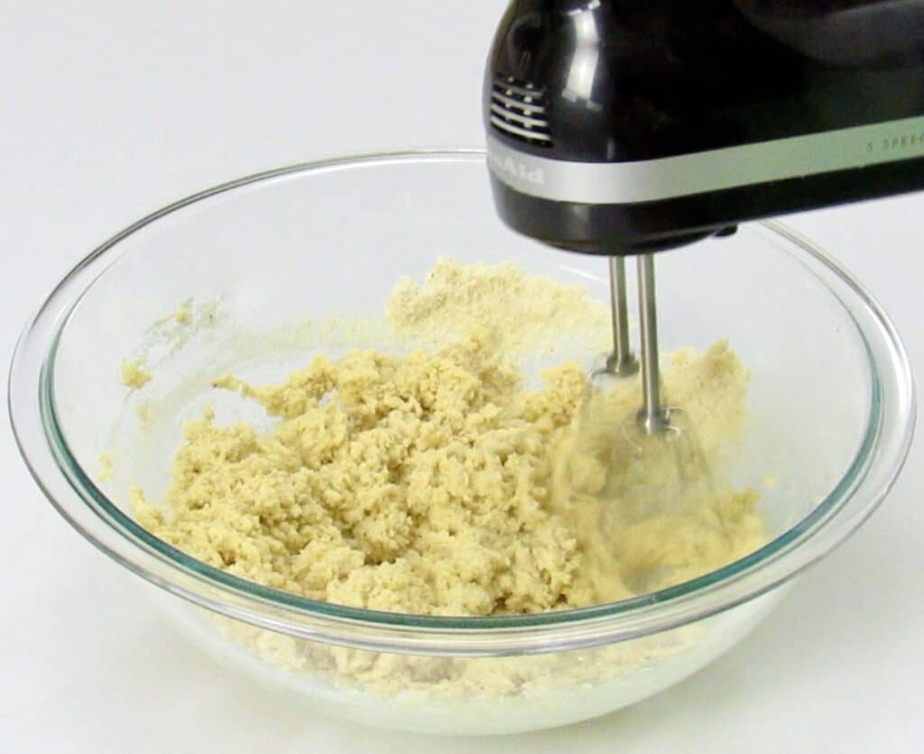 thumbprint cookie dough being mixed with hand mixer
