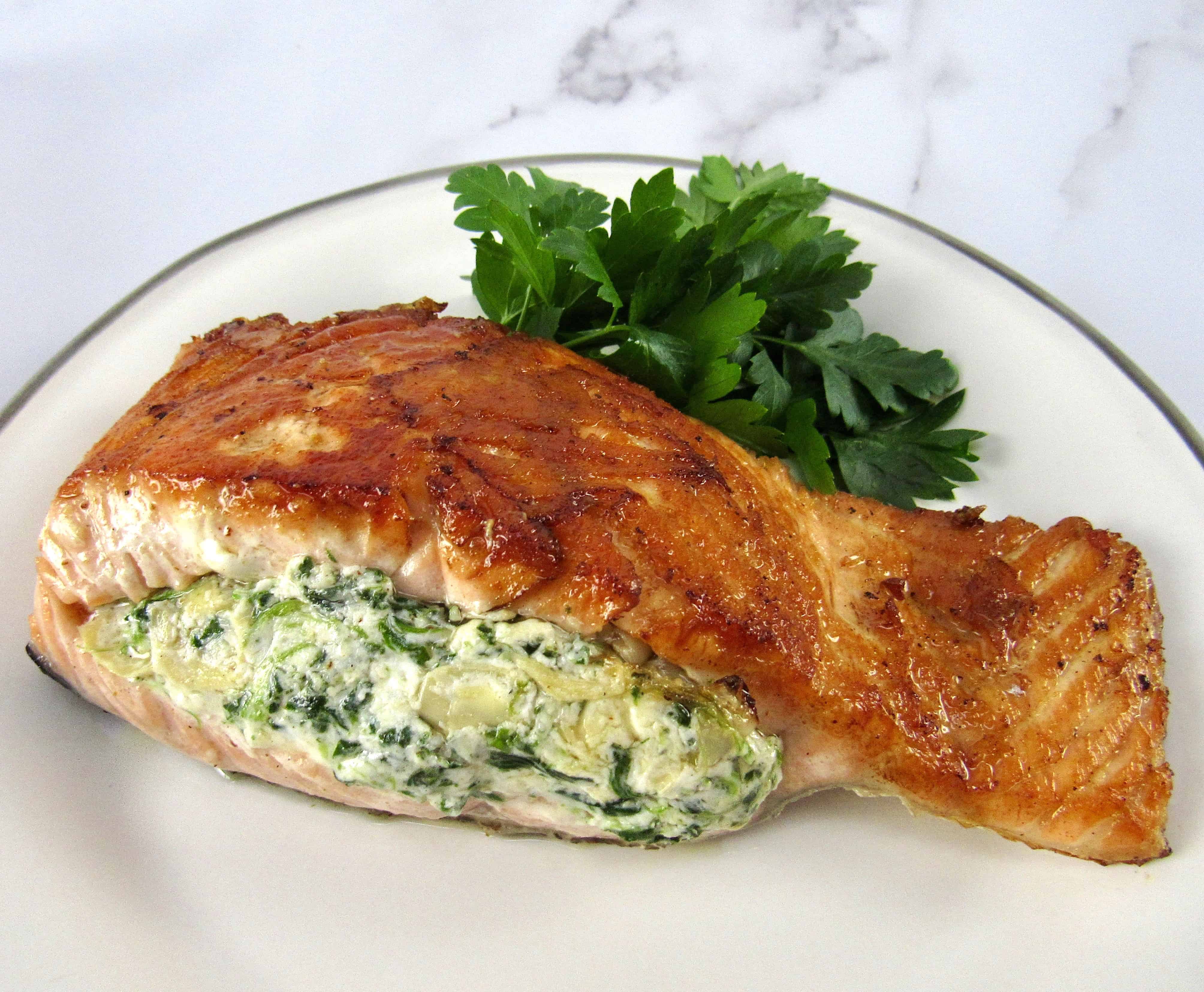 stuffed salmon on plate with parsley