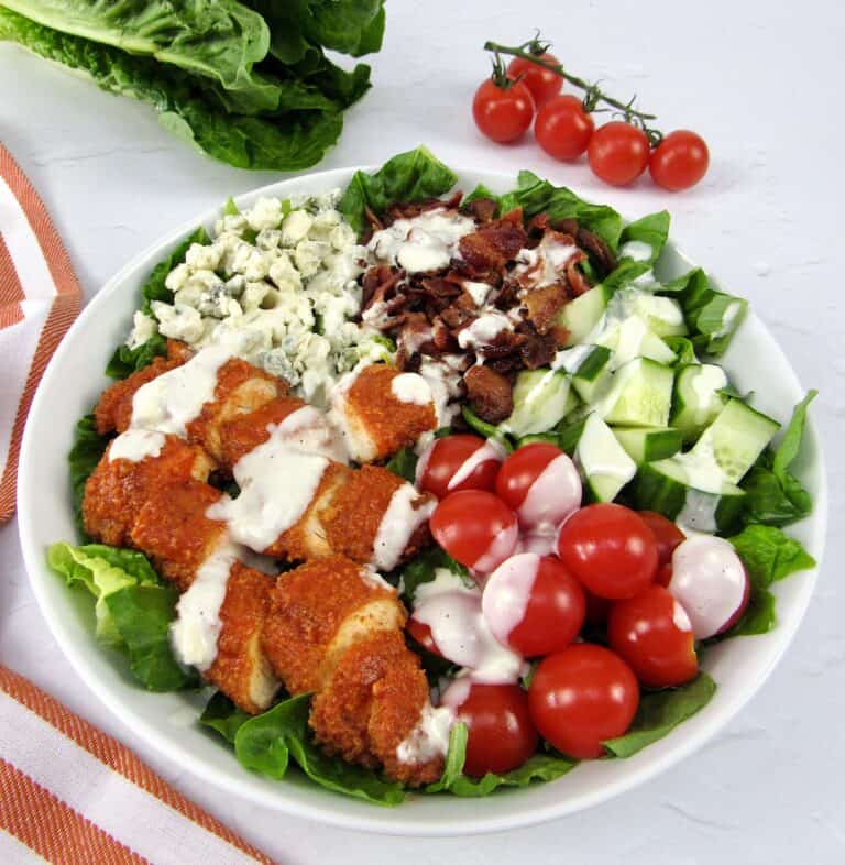 buffalo chicken salad with blue cheese on top