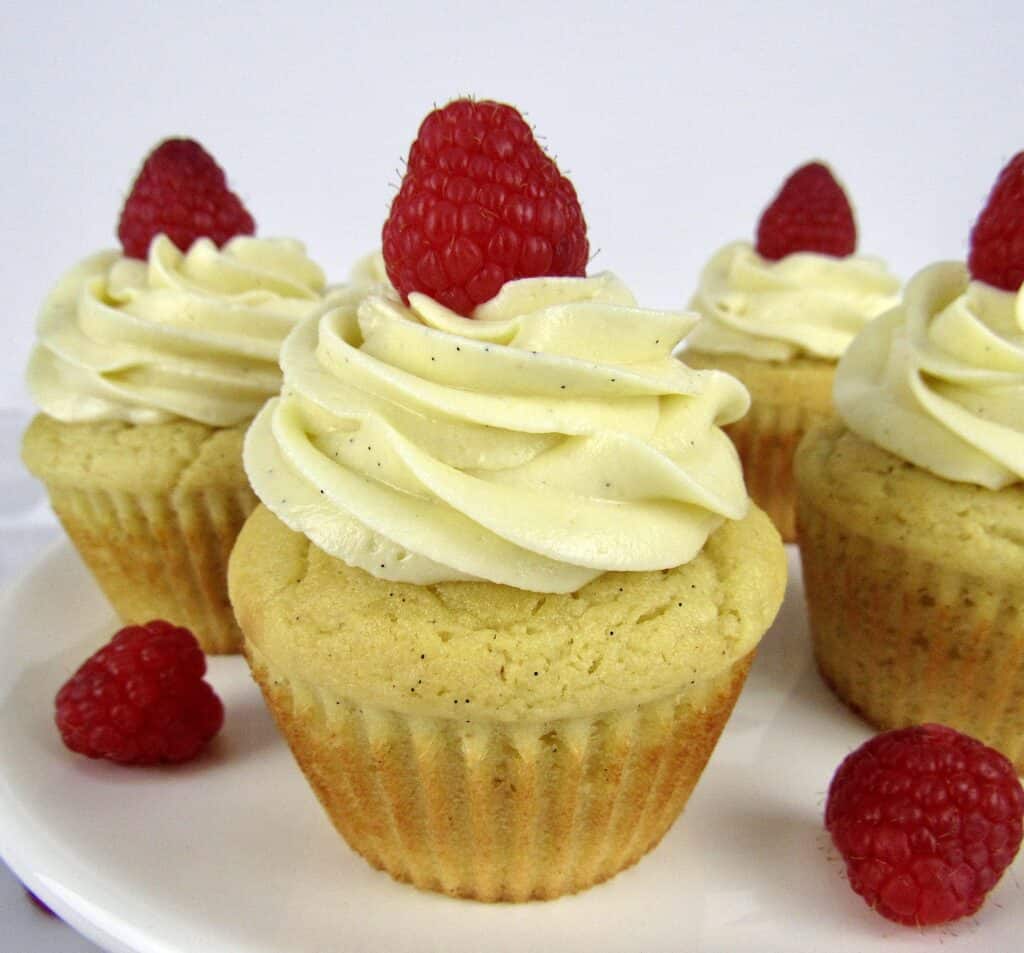vanilla cupcakes with raspberry on top