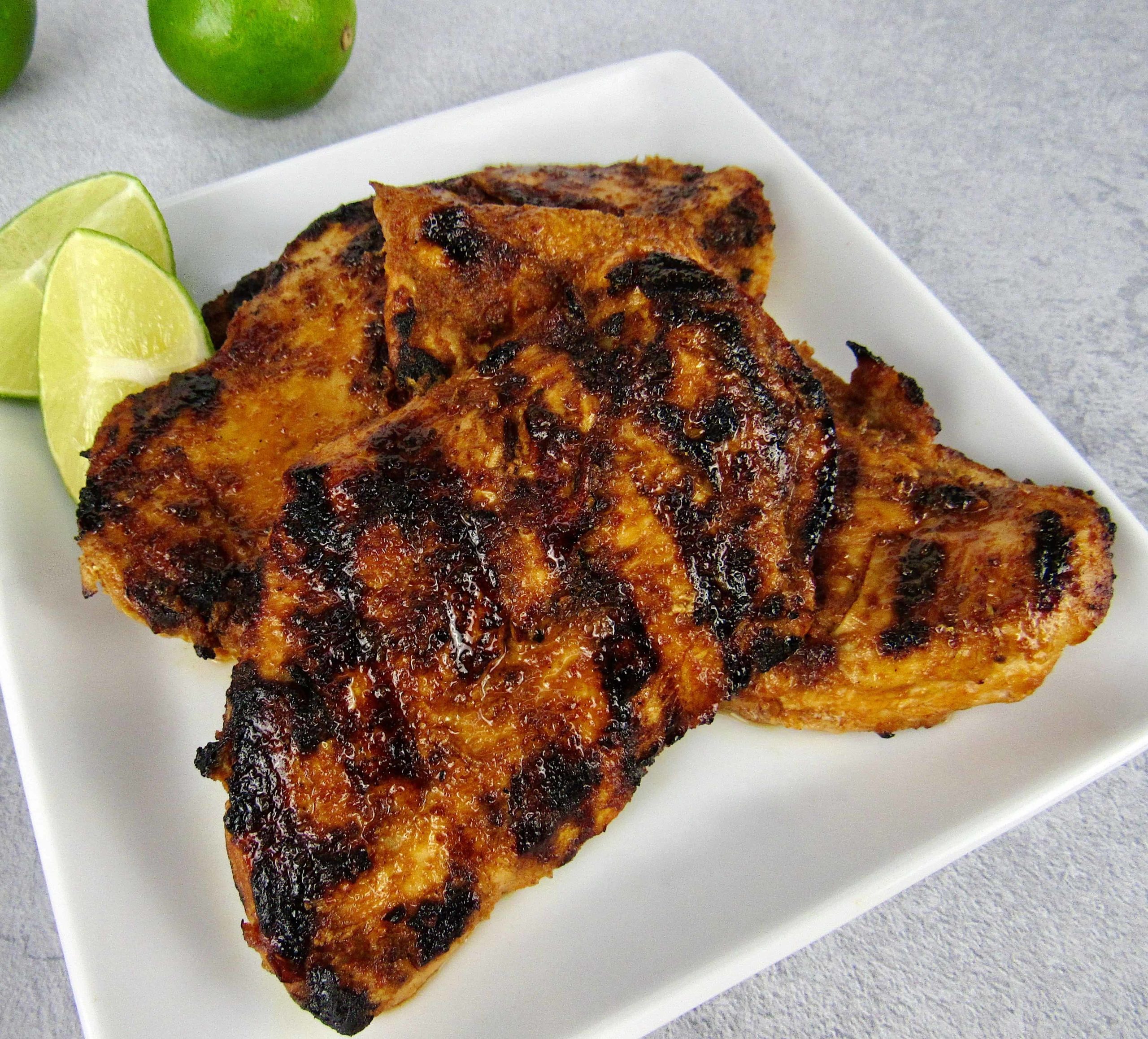 overhead view of closeup of grilled chipotle lime chicken on plate