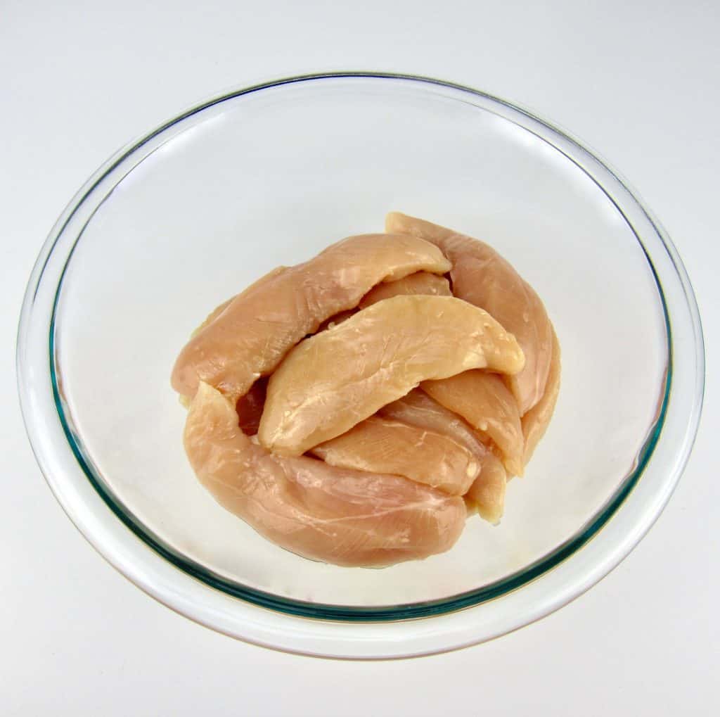 raw chicken tenders in glass bowl