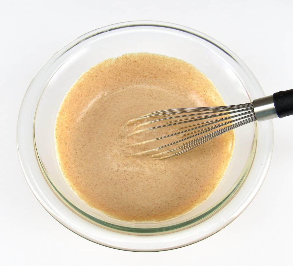 Zesty Dipping Sauce in glass bowl with whisk
