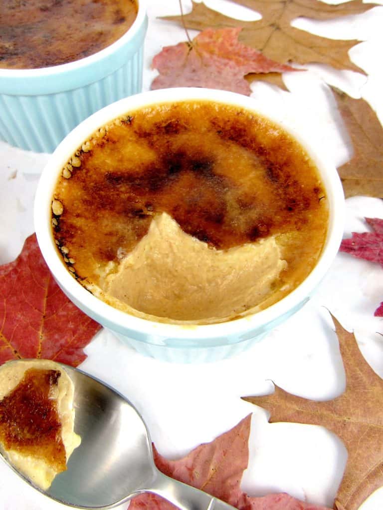 pumpkin creme Brûlée in a ramekin with spoonful on side