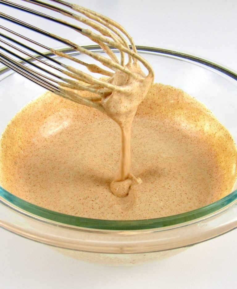 Zesty Dipping Sauce in glass bowl with whisk dripping