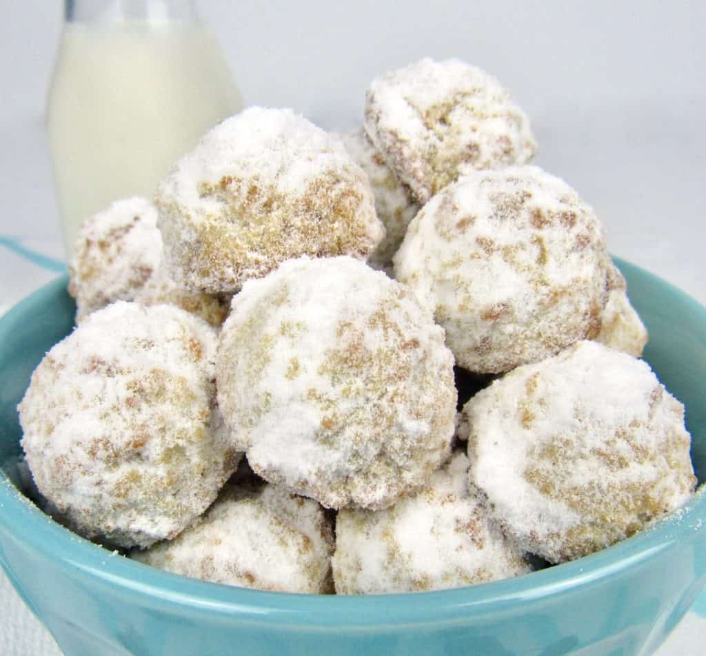 closeup of snowball cookies in blue bowl