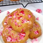 Keto White Chocolate Peppermint Cookies on white plate with cooling rack in back