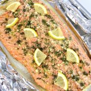 Baked Salmon in Foil with slices of lemon on top