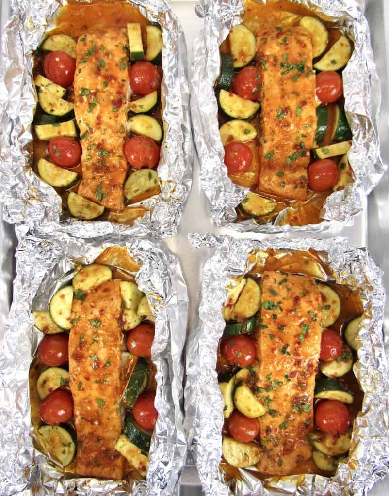 overhead view of salmon and veggies in foil baked