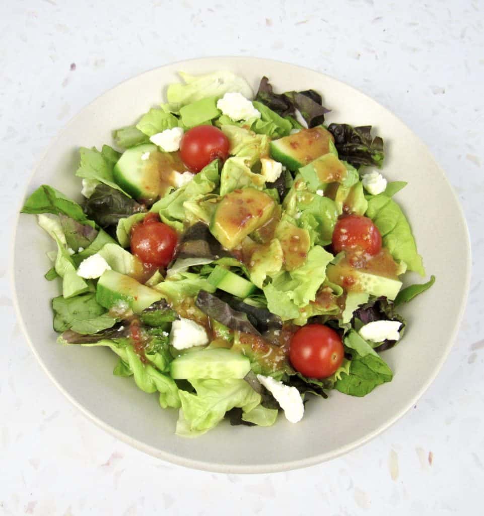 overhead view of salad with chipotle lime vinaigrette on top