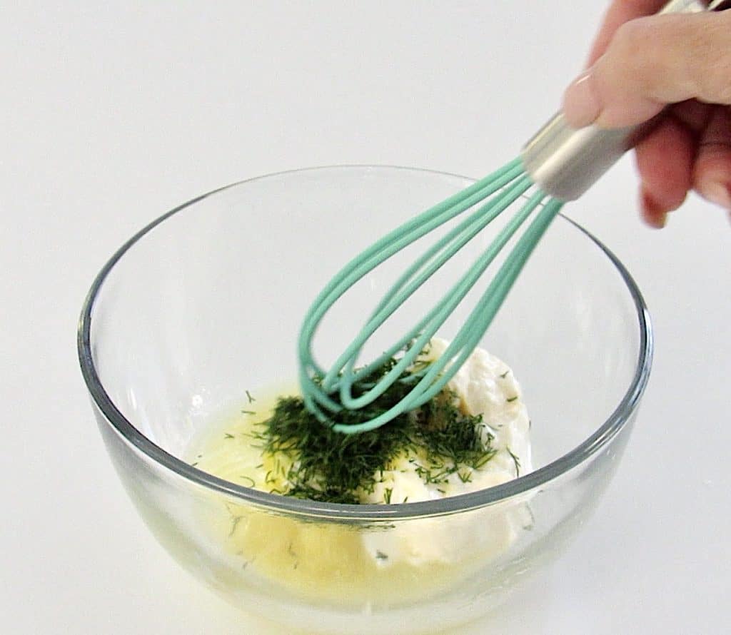 tartar sauce ingredients in bowl with whisk