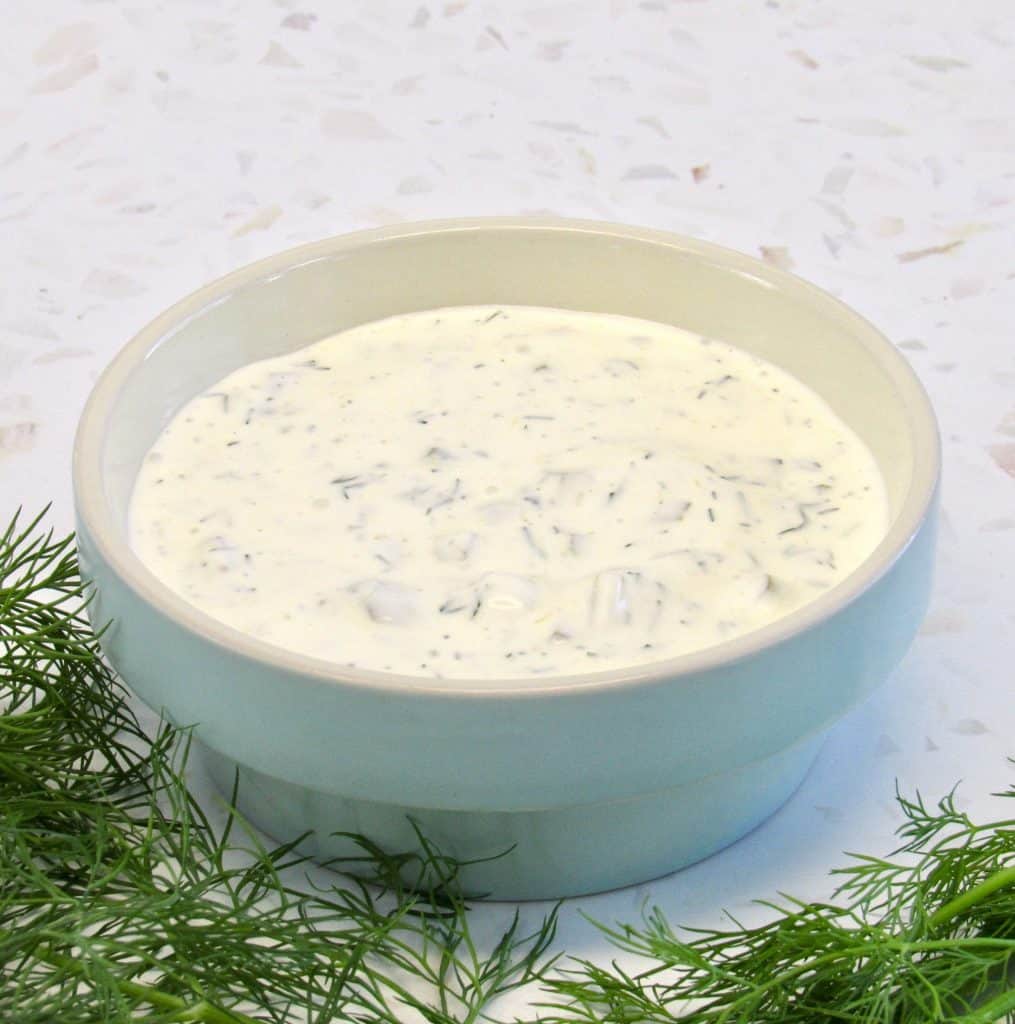 tartar sauce in bowl with dill on side