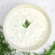 tartar sauce in bowl with dill on top