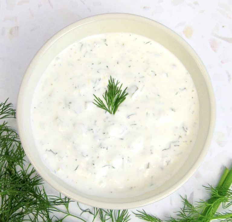 tartar sauce in bowl with dill on top