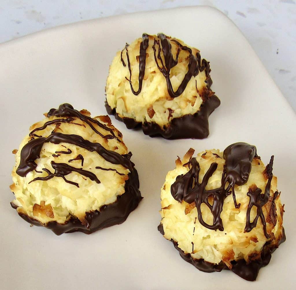 coconut macaroons with chocolate drizzled on top