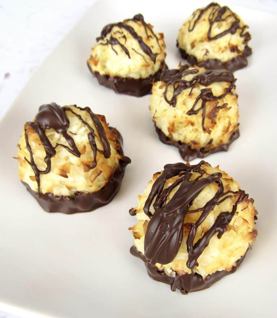 coconut macaroons with chocolate drizzled on top