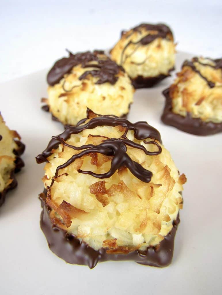 coconut macaroons with chocolate drizzled on top