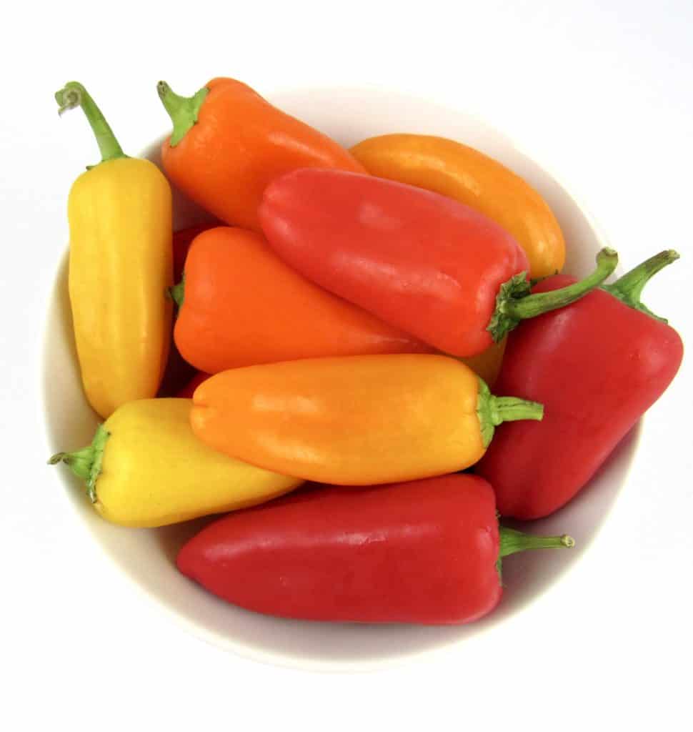 bowl of red yellow and red mini peppers
