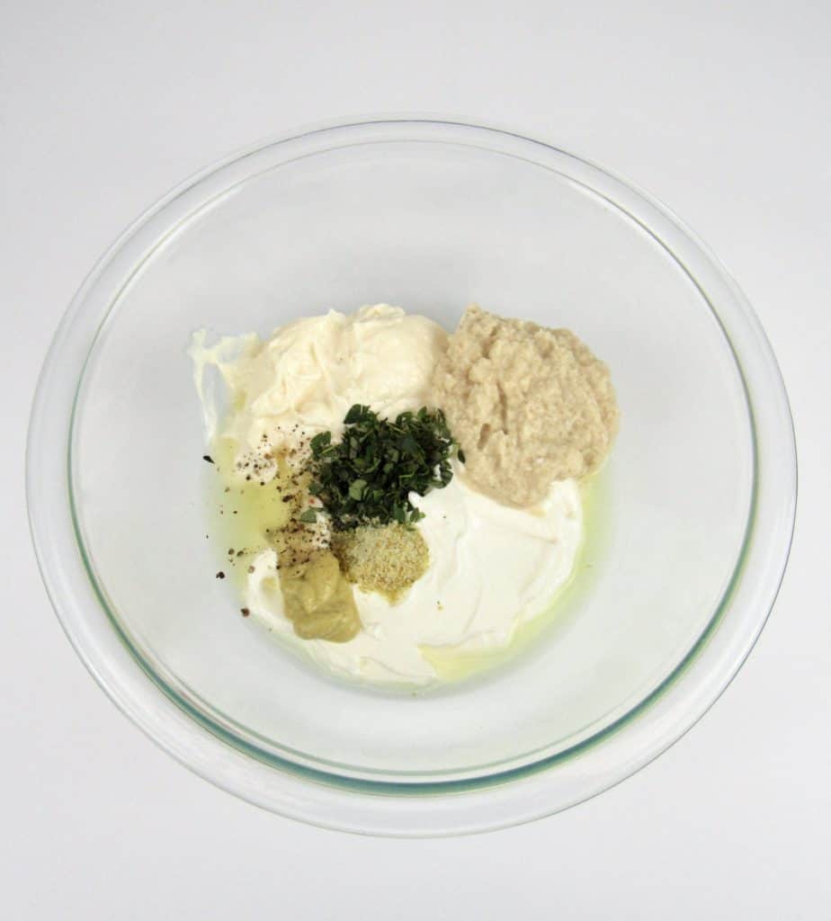 Creamy Horseradish Sauce ingredients in glass bowl unmixed